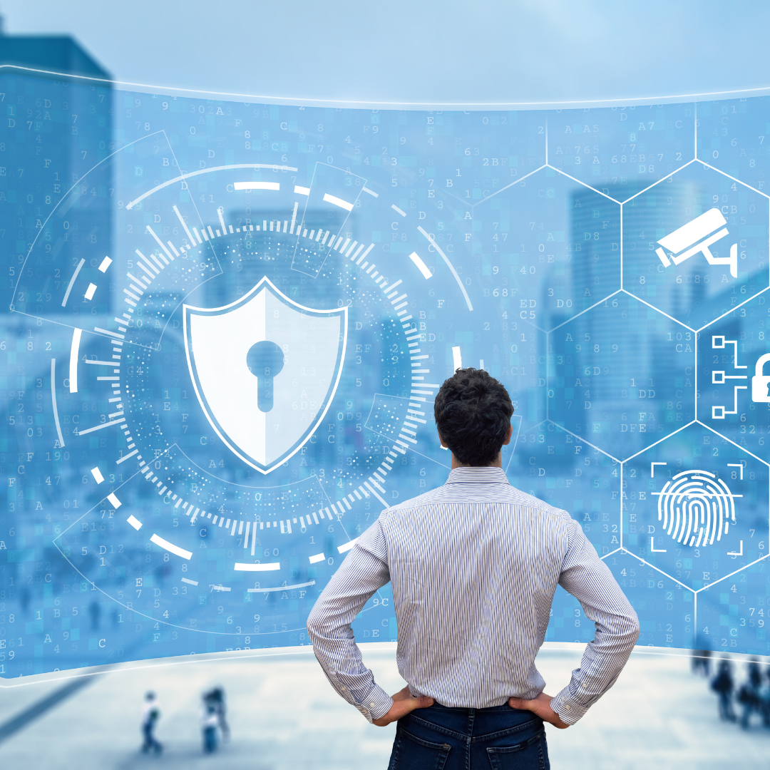 A man is looking at a screen with a shield on it.